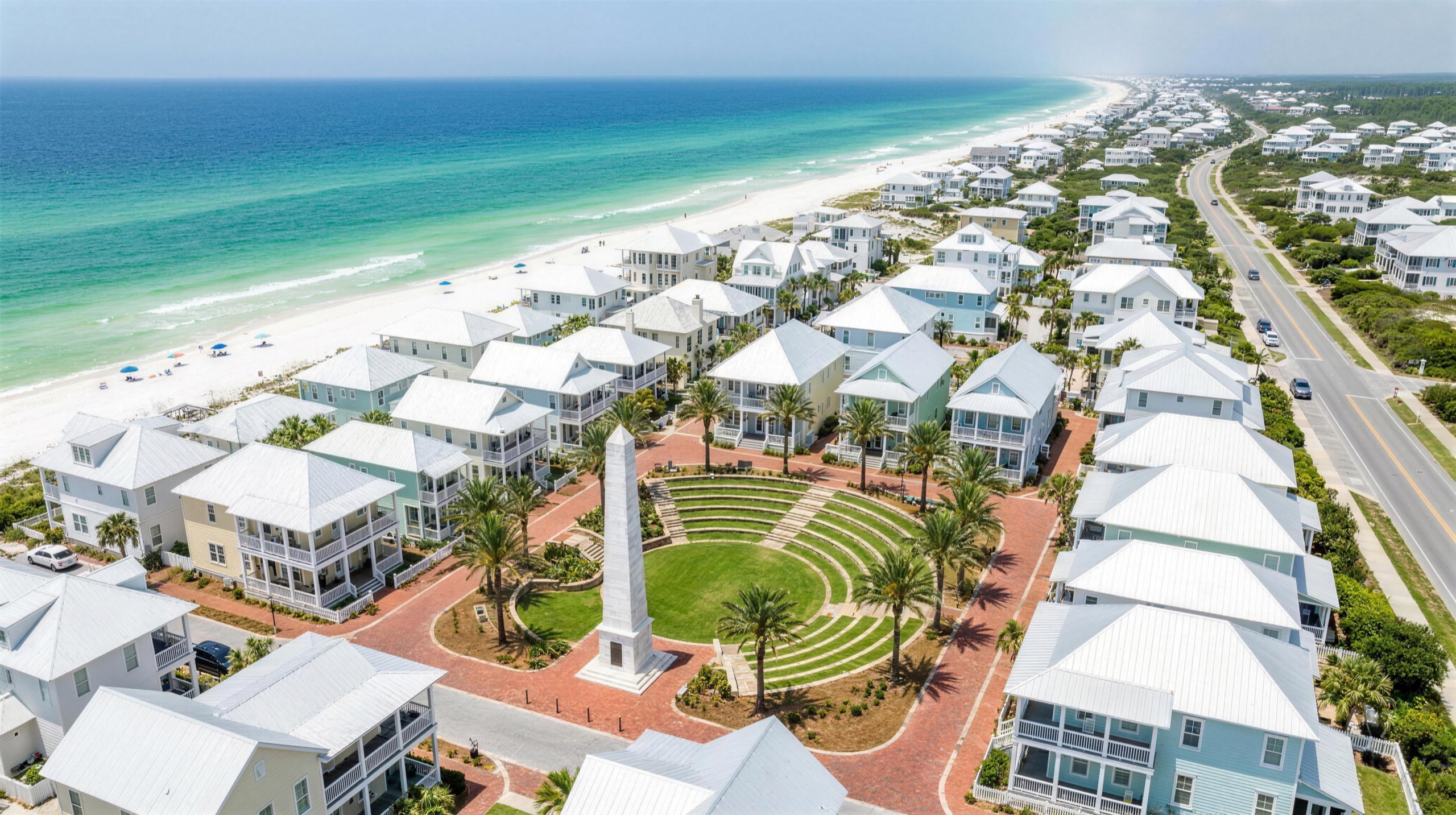Aerial of the 30A coastline at Santa Rosa Beach, Florida — white beach cottages, emerald Gulf and Scenic Highway 30A near Studio Beige