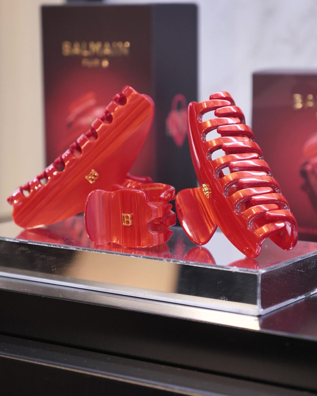 Red Balmain claw clips on display at the house in Amsterdam