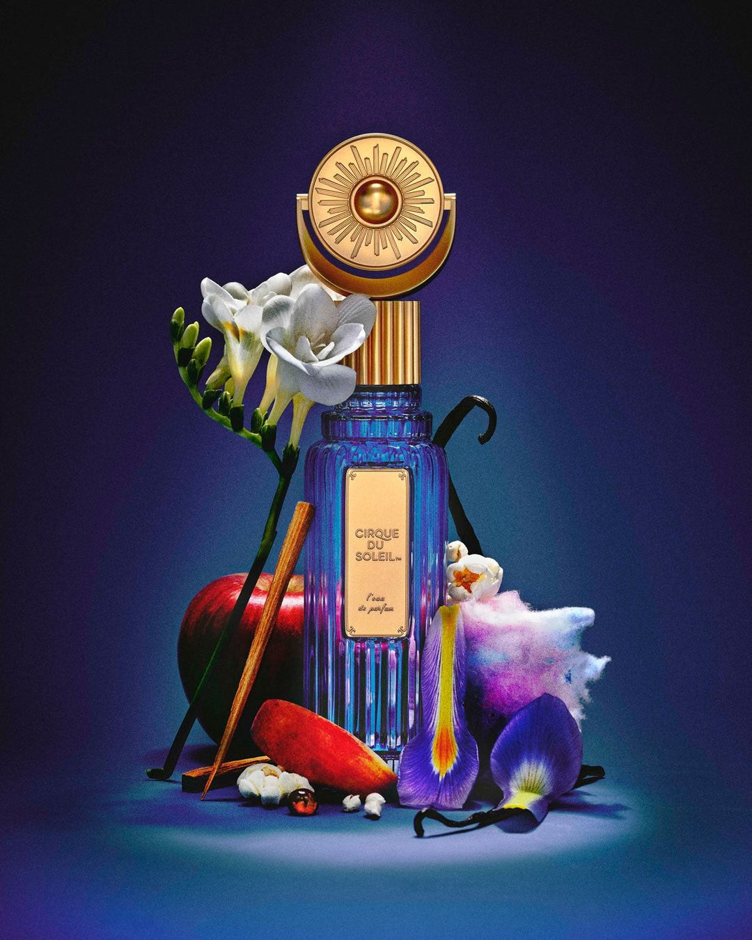Cirque du Soleil L'eau de Parfum bottle on deep blue